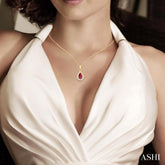 5x3 MM Pear Shape Ruby and 1/20 Ctw Single Cut Diamond Halo Precious Pendant with Chain in 10K Yellow Gold